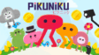 The red stretchy character Piku standing in a colorful minimalist village in Pikuniku